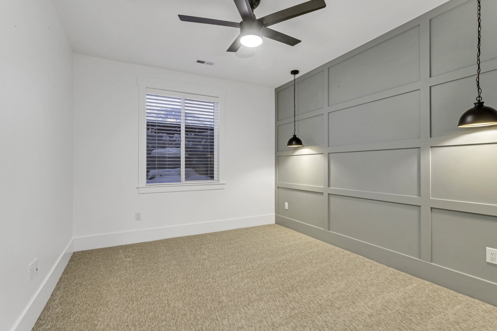 Finished basement room with recessed lighting and carpet