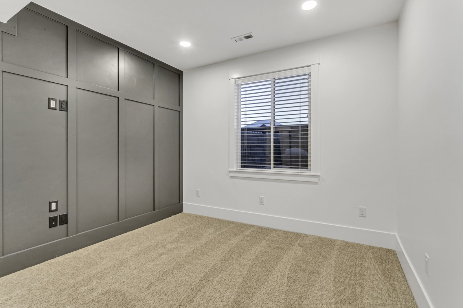 Finished basement space with fresh paint and new flooring