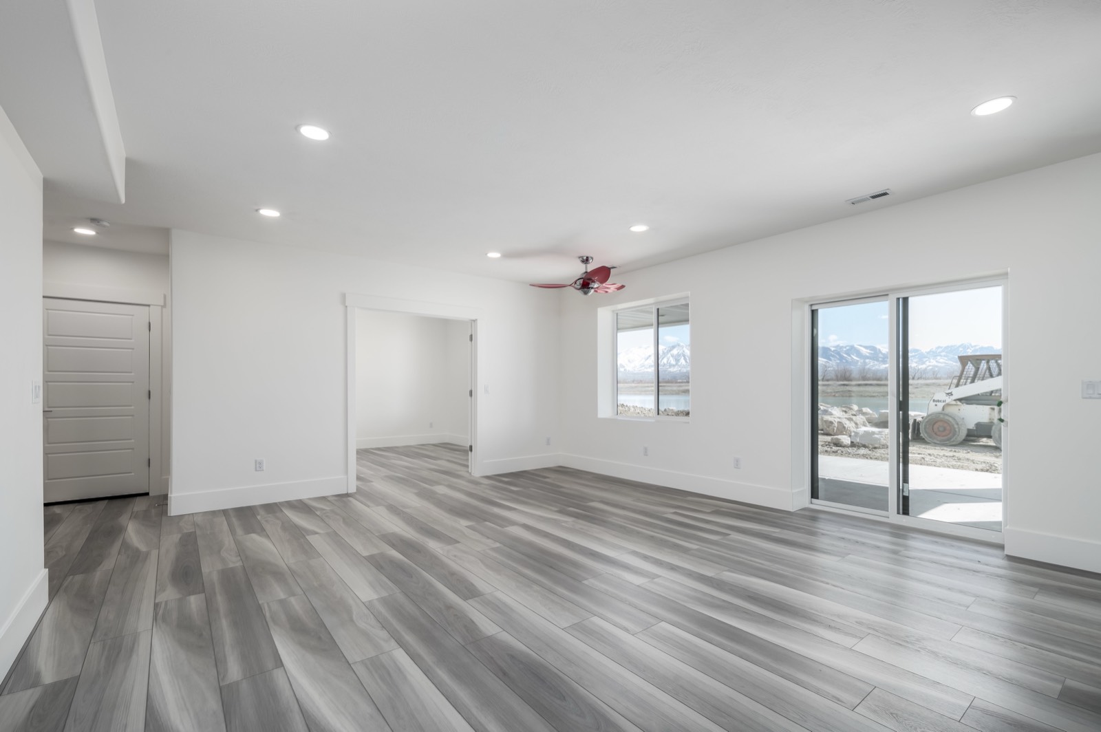 Finished basement apartment living area with clean paint and new flooring