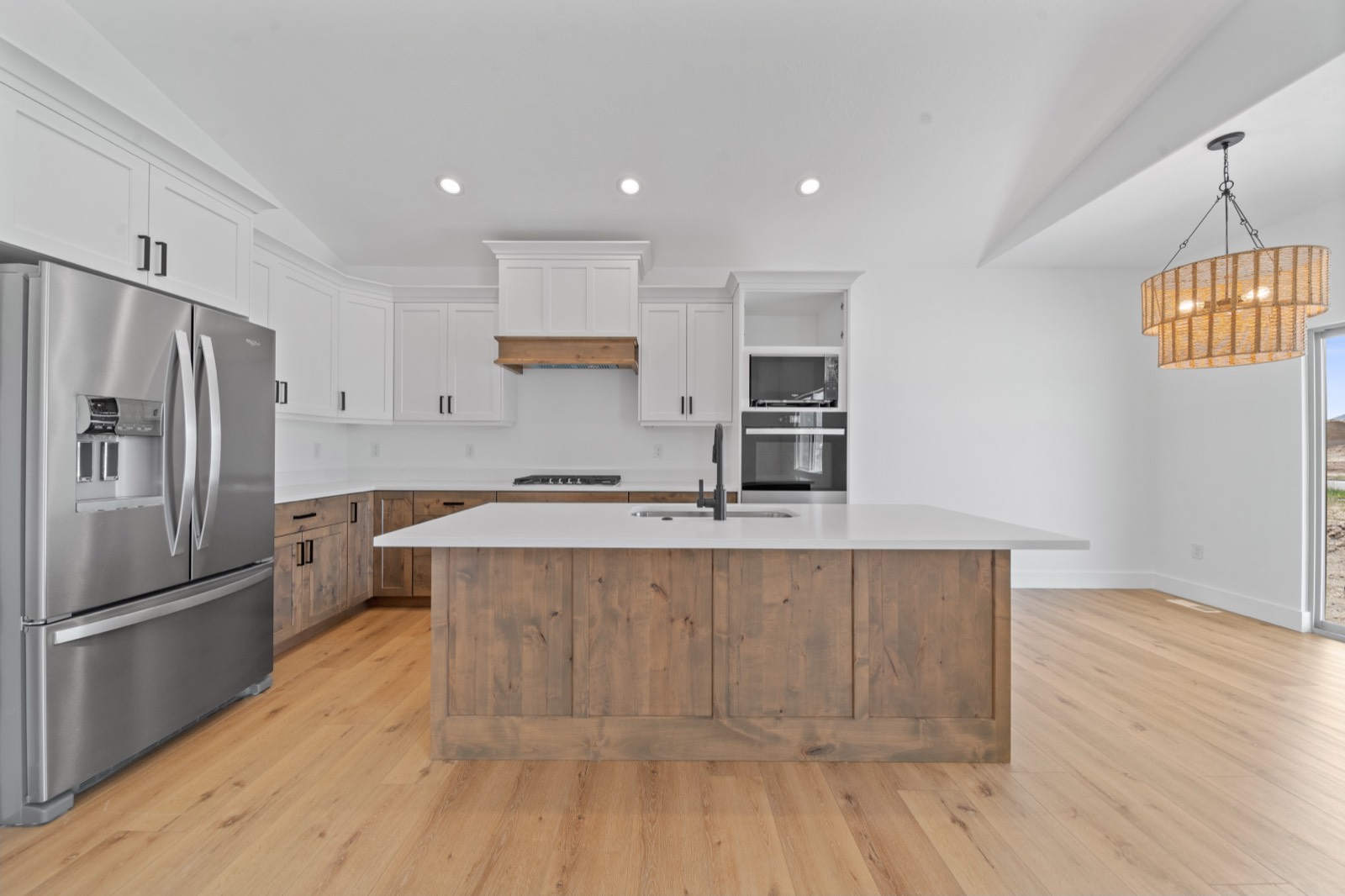 Kitchen with custom cabinetry and stone countertops